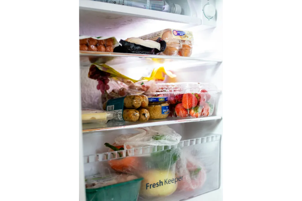 A fridge filled with day to day necessary veggies and fruits.-Keep produce fresh longer