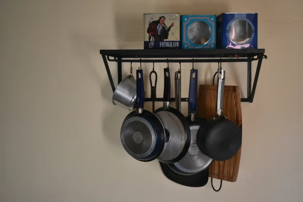 Wall-mounted shelf and hooks for a kitchen