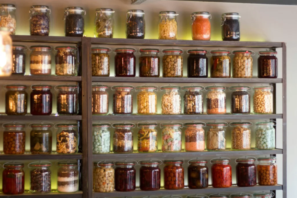 Bunch of spices jars on a large spice rack.