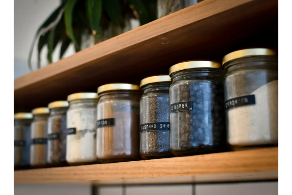 spice jars on a wall mounted rack