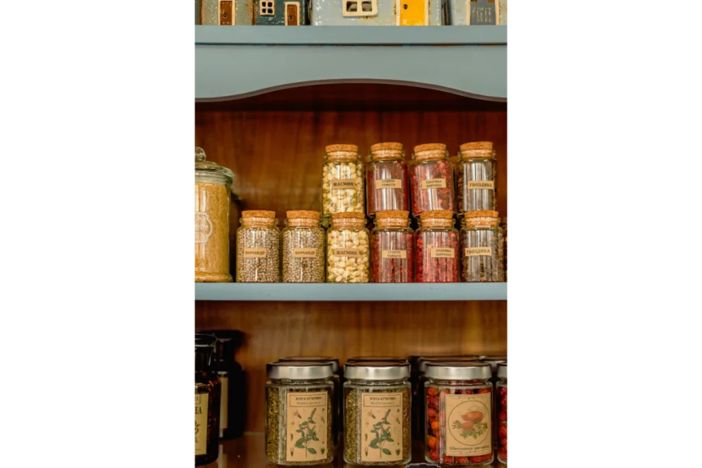 Spice jars stored on a self.