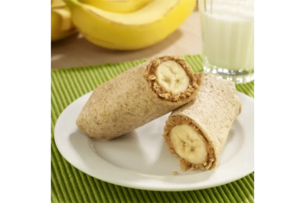 banana peanut butter wrap in a white plate