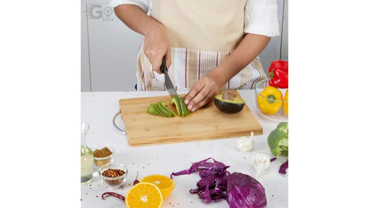 Bamboo chopping board with fresh vegetables ready for prep.