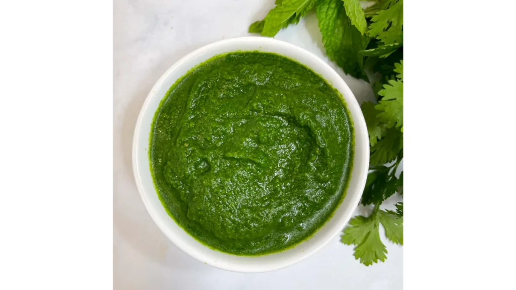 Spicy Green Chutney Recipe in a Bowl – A freshly prepared bowl of green chutney with a rich, vibrant color.